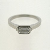 18ct white gold ring set with an emerald cut diamond