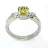 Platinum ring set with a natural fancy yellow diamond